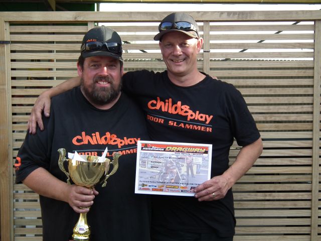 Rod Benjes and partner John Dillon with the 1st Auto Parts Top Doorslammer winners trophy