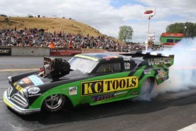 Wayne Yearbury. 1953 Studebaker. <br>Burnout before recording the quickest and fastest Top Doorslammer pass in New Zealand, a 6.160 at 235.89 mph, to win the 2014 Nitro Shootout. [Photo by: Ian Rainbow]